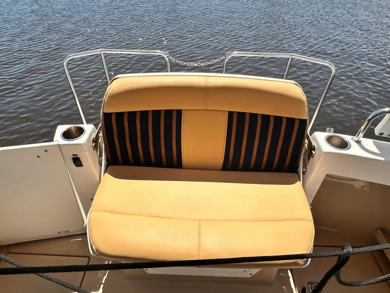 Slide: The Image of 2014 Cutwater C 26 boat with cushioned seating at the stern. - 29