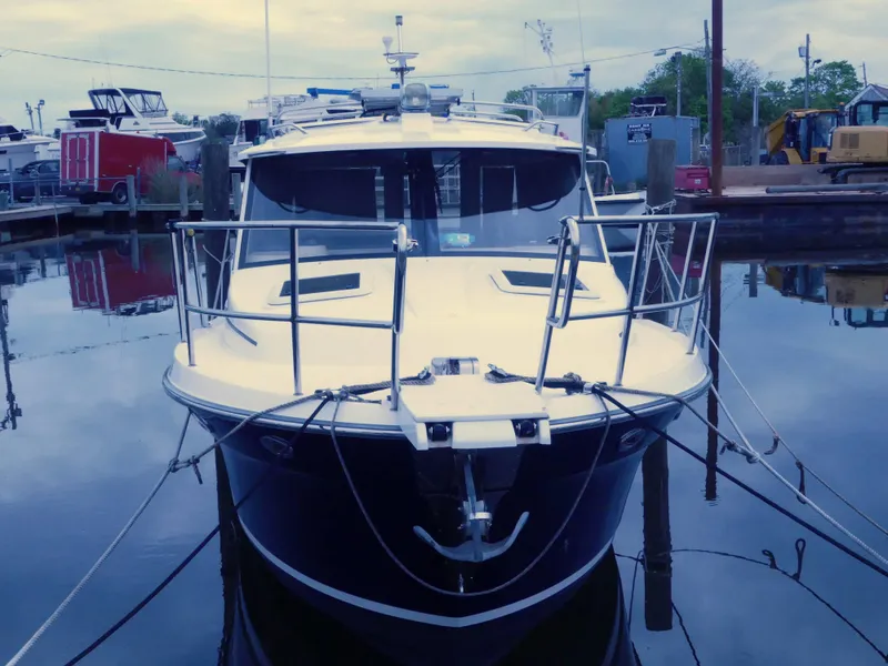 Slide: The Image of 2014 Cutwater C 26 boat docked at marina, front view. - 3