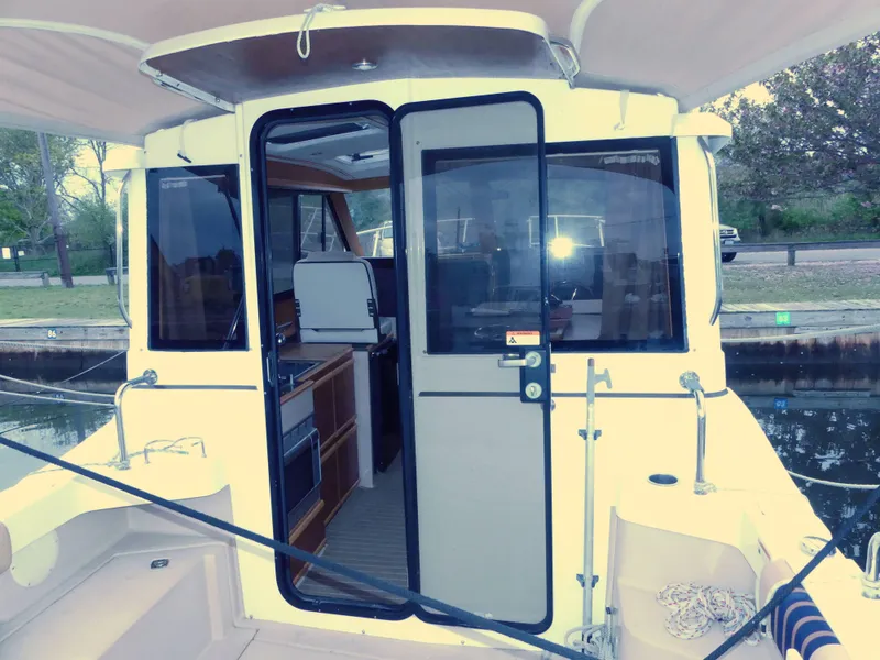 Slide: The Image of 2014 Cutwater C 26 boat interior view with open sliding door. - 5