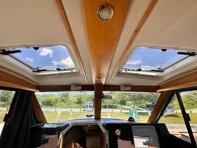 Slide: The Image of Interior view of 2014 Cutwater C 26 boat with skylights and navigation equipment. - 22