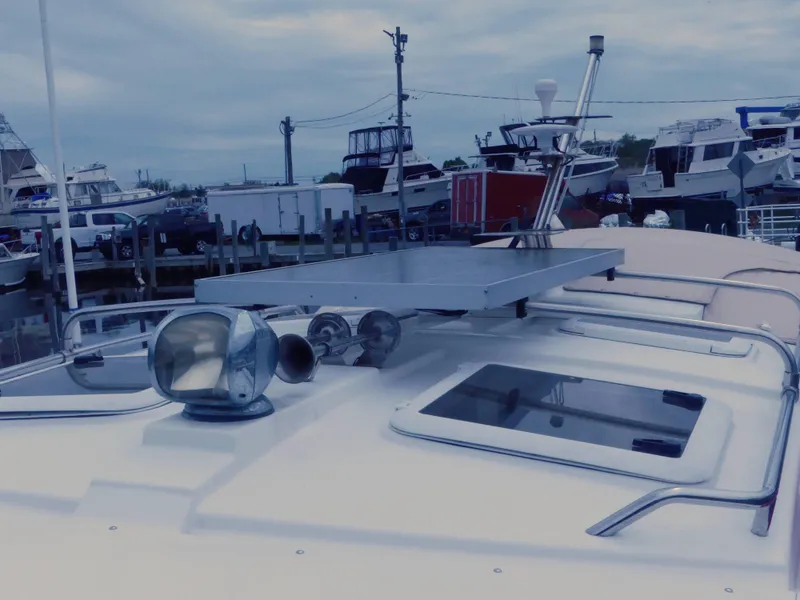 Slide: The Image of 2014 Cutwater C 26 boat docked at a marina with other boats in the background. - 4