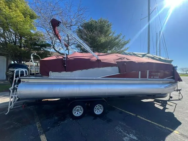 The Image of 2014 Harris FloteBote Grand Mariner 250 pontoon boat on trailer with red cover. - 0
