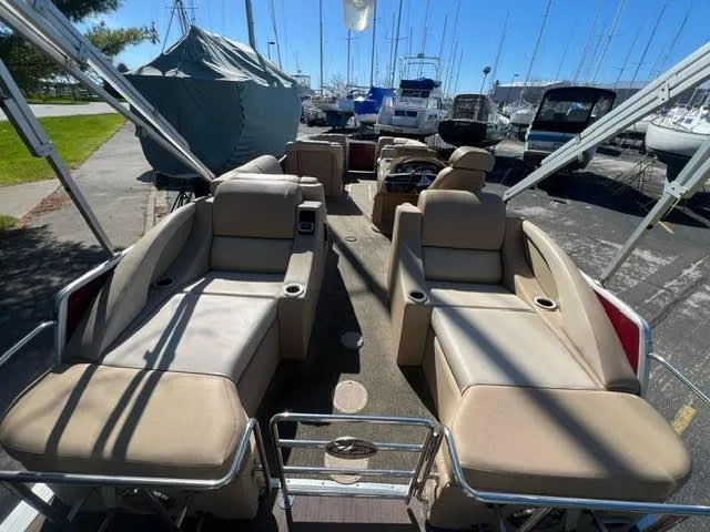 Slide: The Image of 2014 Harris FloteBote Grand Mariner 250 pontoon boat with spacious seating at a marina. - 15