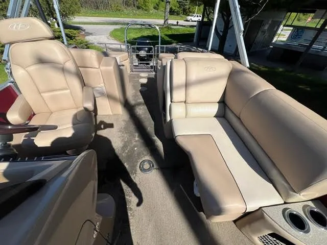 Slide: The Image of 2014 Harris FloteBote Grand Mariner 250 interior with beige seating and spacious layout. - 22