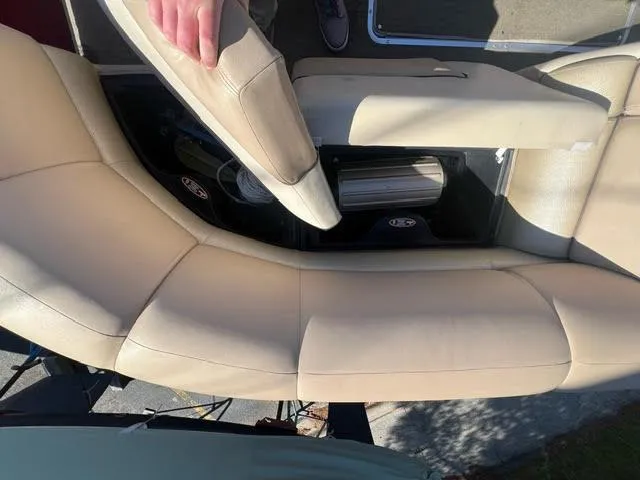 Slide: The Image of 2014 Harris FloteBote Grand Mariner 250 beige leather seating with storage compartment. - 29