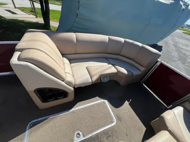 Slide: The Image of 2014 Harris FloteBote Grand Mariner 250 interior seating area with beige upholstery. - 30