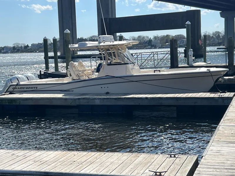 The Image of 2019 Grady-White Canyon 306 boat docked at marina, sunny day. - 0