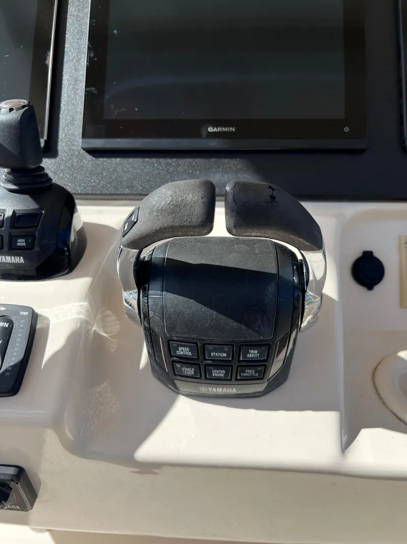 Slide: The Image of Control panel of a 2019 Grady-White Canyon 306 boat with Yamaha throttle. - 15