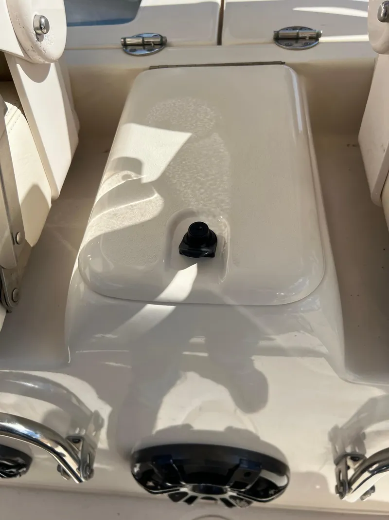 Slide: The Image of 2019 Grady-White Canyon 306 boat interior detail with storage compartment and latch. - 18