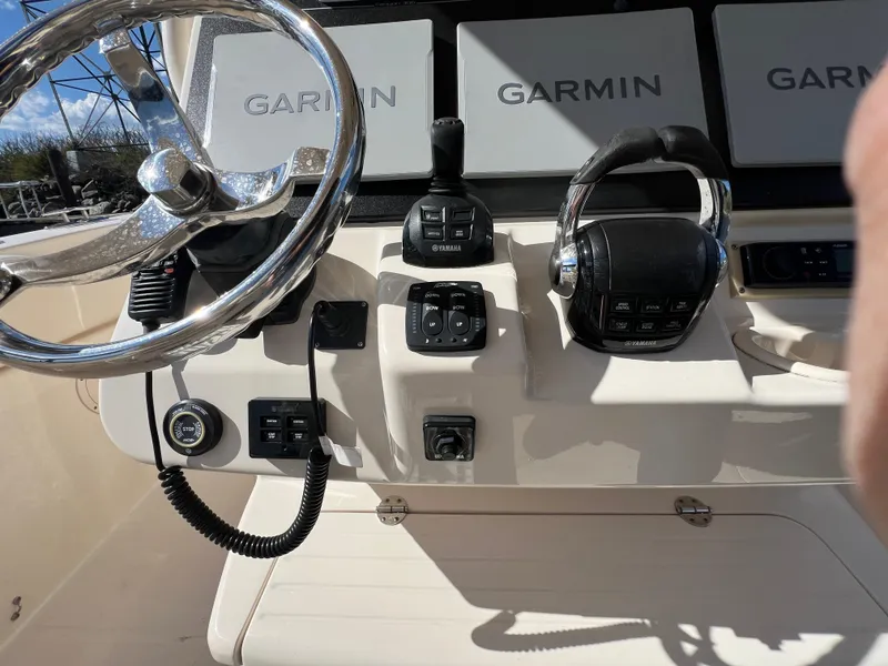 Slide: The Image of 2019 Grady-White Canyon 306 helm with Garmin displays and Yamaha controls. - 21