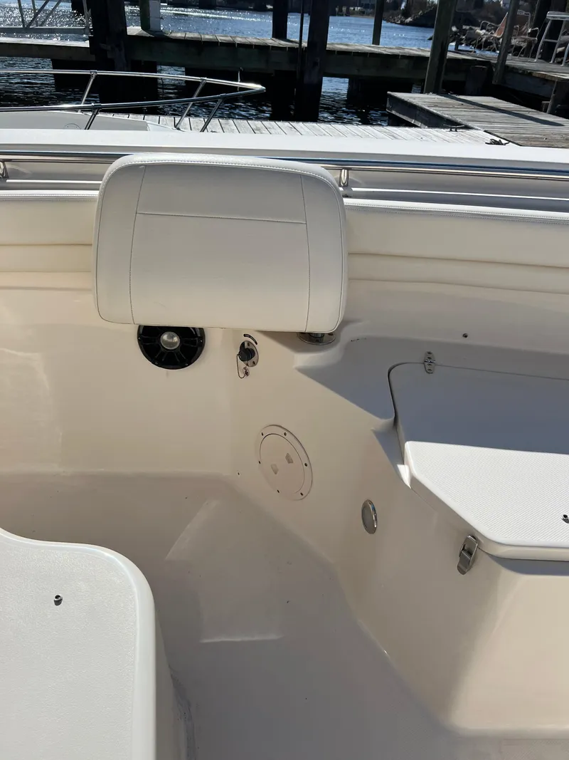 Slide: The Image of 2019 Grady-White Canyon 306 boat interior with seating and dock view. - 24