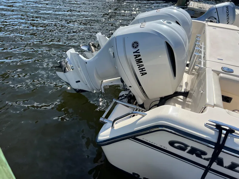 Slide: The Image of 2019 Grady-White Canyon 306 boat with Yamaha outboard engines on water. - 25