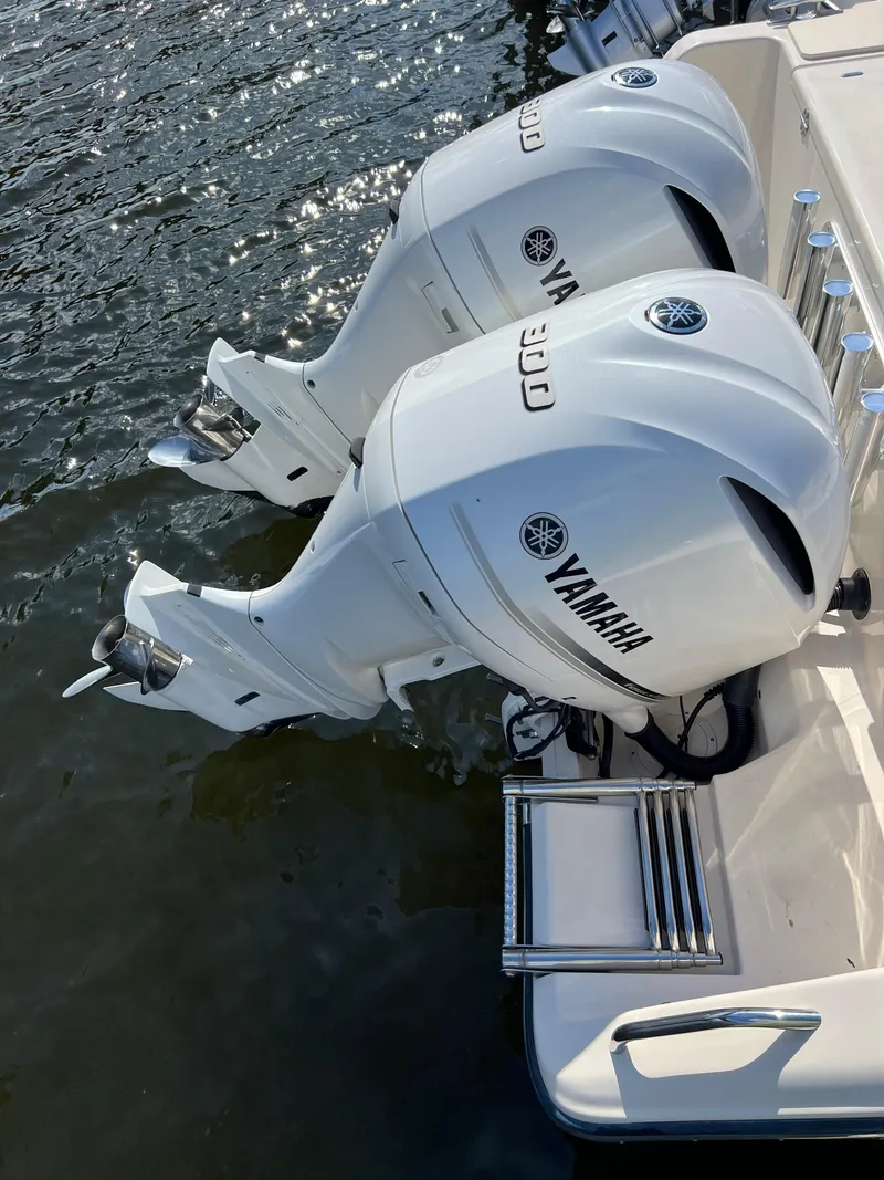 Slide: The Image of Twin Yamaha 300 outboard engines on a 2019 Grady-White Canyon 306 boat. - 26