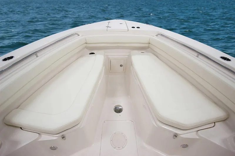 Slide: The Image of 2019 Grady-White Canyon 306 boat interior with cushioned seating, ocean view. - 36