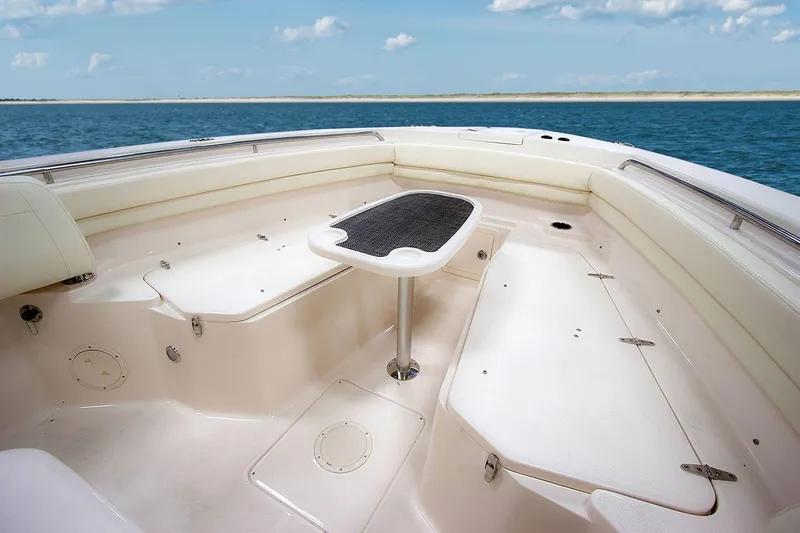 Slide: The Image of 2019 Grady-White Canyon 306 boat interior with seating and table, ocean view. - 38