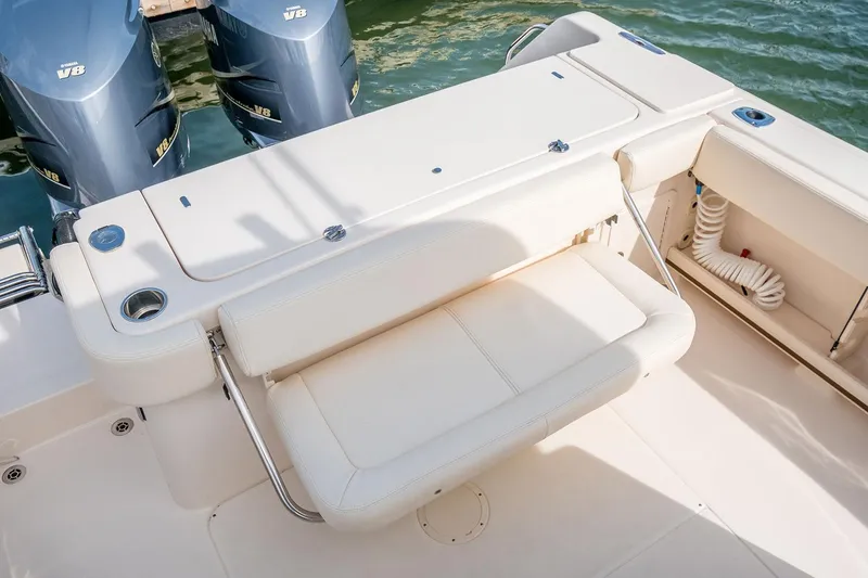 Slide: The Image of 2019 Grady-White Canyon 306 boat with dual Yamaha V8 engines and foldable seating. - 45