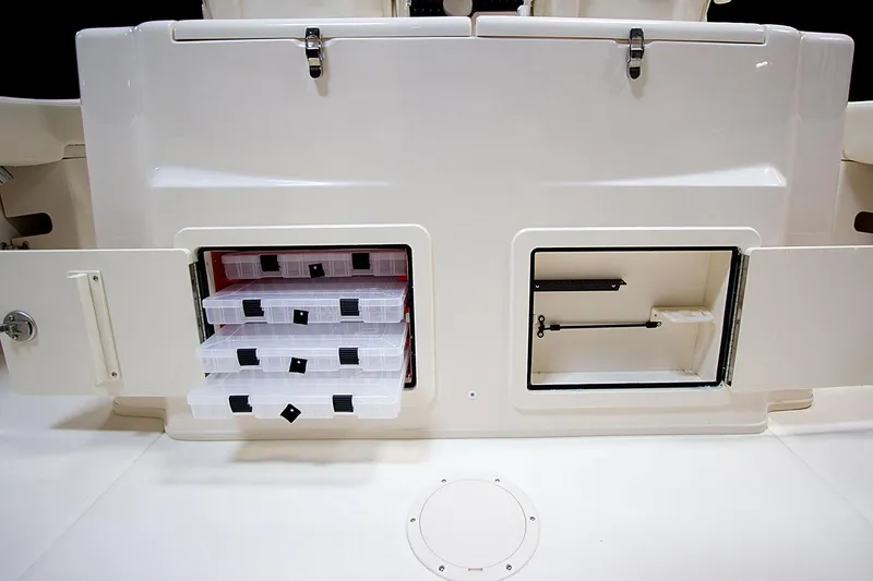 Slide: The Image of 2019 Grady-White Canyon 306 storage compartments with tackle boxes and utility space. - 47