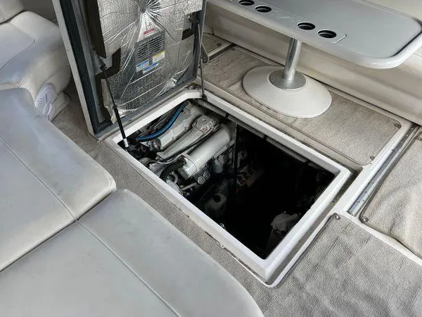 Slide: The Image of Engine compartment of a 2001 Sea Ray 460 Sundancer yacht with open hatch. - 13