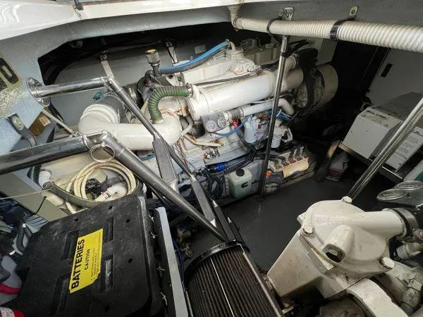 Slide: The Image of Engine room of a 2001 Sea Ray 460 Sundancer yacht with visible components. - 14