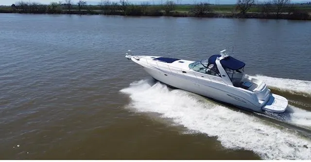 Slide: The Image of 2001 Sea Ray 460 Sundancer cruising on a river. - 29