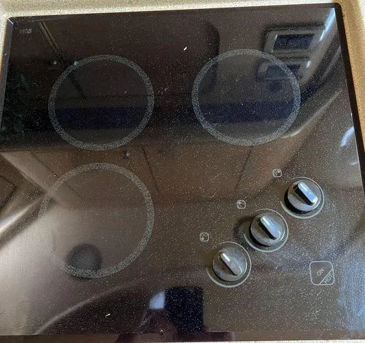 Slide: The Image of Electric stovetop in a 2001 Sea Ray 460 Sundancer yacht kitchen. - 8