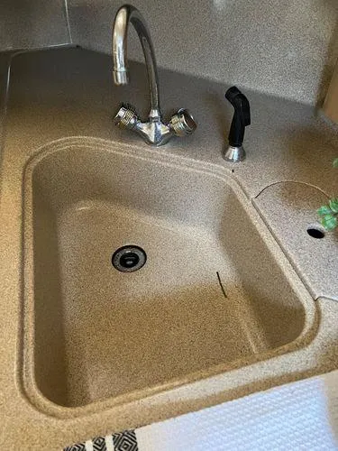 Slide: The Image of 2001 Sea Ray 460 Sundancer kitchen sink with faucet and sprayer. - 9