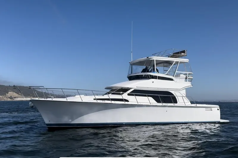 Slide: The Image of 2026 Mikelson 45 Gen III Sportfish yacht cruising on open water. - 1