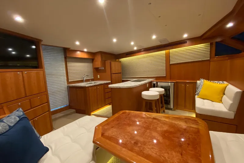 Slide: The Image of Luxurious interior of 2026 Mikelson 45 Gen III Sportfish yacht with modern kitchen and seating. - 3