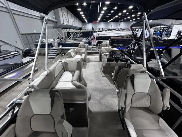 Slide: The Image of 2024 Avalon Venture Fish N Cruise 21 FT pontoon boat interior at a boat show. - 12
