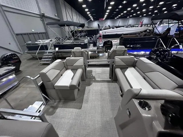 Slide: The Image of 2024 Avalon Venture Fish N Cruise 21 FT pontoon boat interior at a boat show. - 13