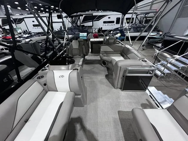 Slide: The Image of 2024 Avalon Venture Fish N Cruise 21 FT pontoon boat interior with seating and canopy. - 8