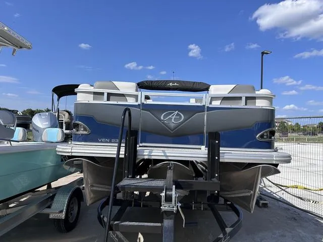 Slide: The Image of 2024 Avalon Venture Quad Lounger 23 FT pontoon boat with layout and seating. - 2