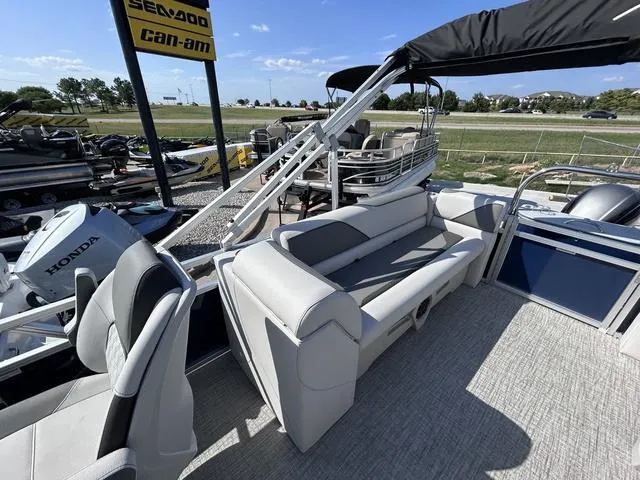 Slide: The Image of 2024 Avalon Venture Quad Lounger 23 FT pontoon boat with Honda engine, outdoor display. - 7