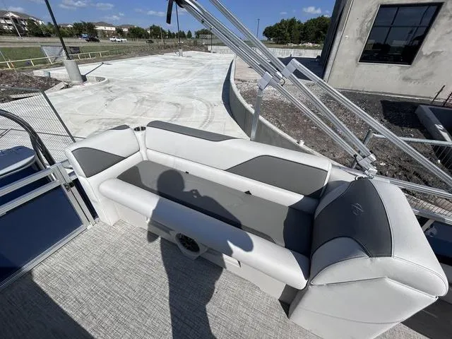 Slide: The Image of 2024 Avalon Venture Quad Lounger 23 FT boat interior with gray seating. - 8