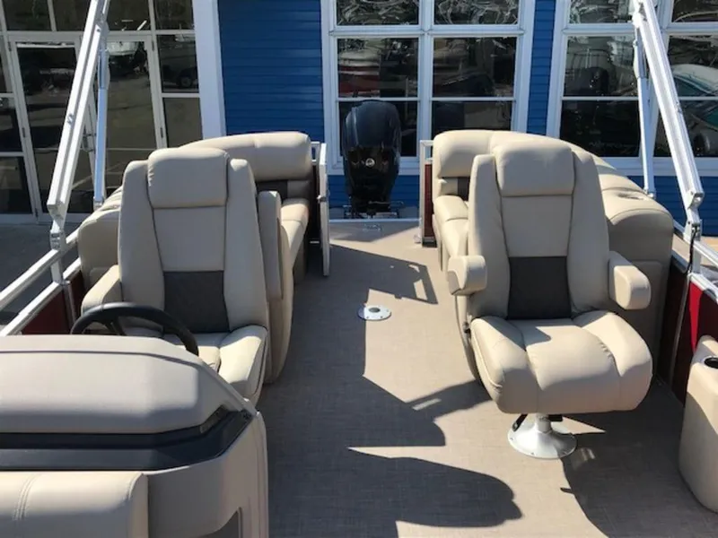 Slide: The Image of 2024 Sun Tracker PB 22 DLX pontoon boat with beige seating and modern design. - 12