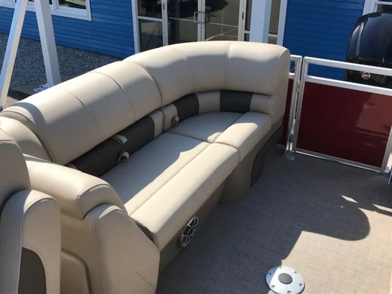 Slide: The Image of 2024 Sun Tracker PB 22 DLX pontoon boat with beige seating and red paneling. - 14