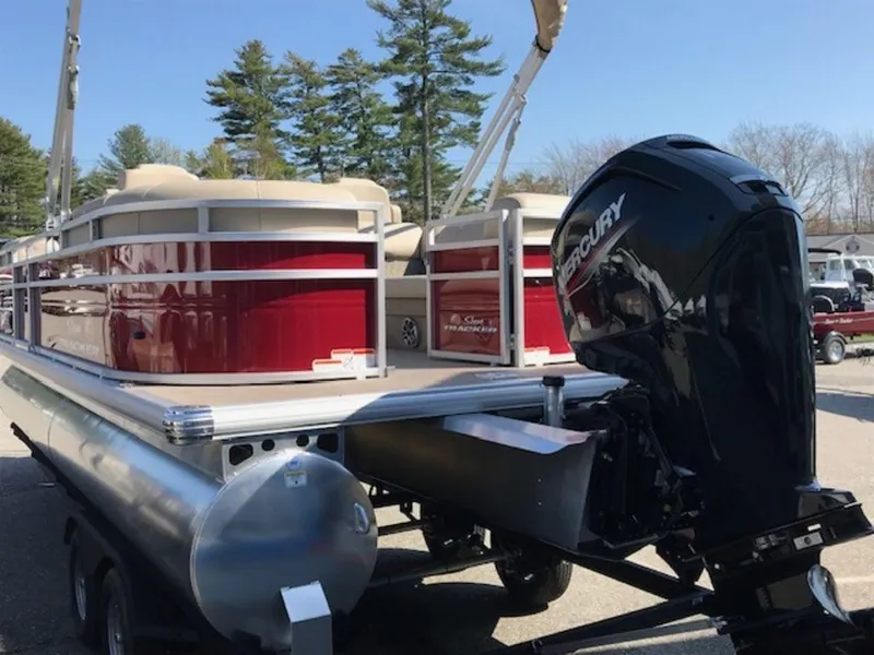 Slide: The Image of 2024 Sun Tracker PB 22 DLX pontoon boat with Mercury outboard motor. - 3