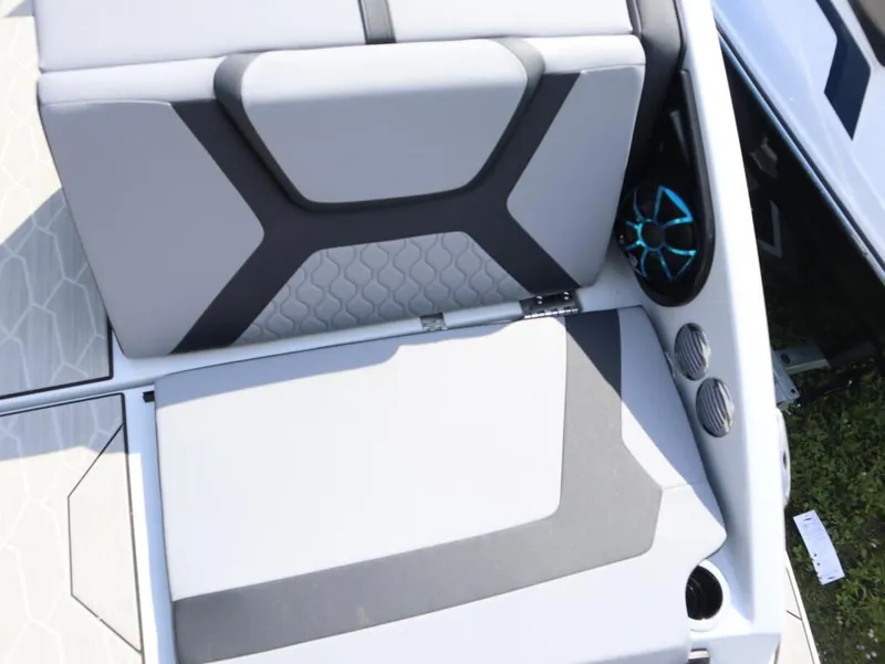 Slide: The Image of 2024 Yamaha Boats 222XE interior seating with modern design and integrated speakers. - 10