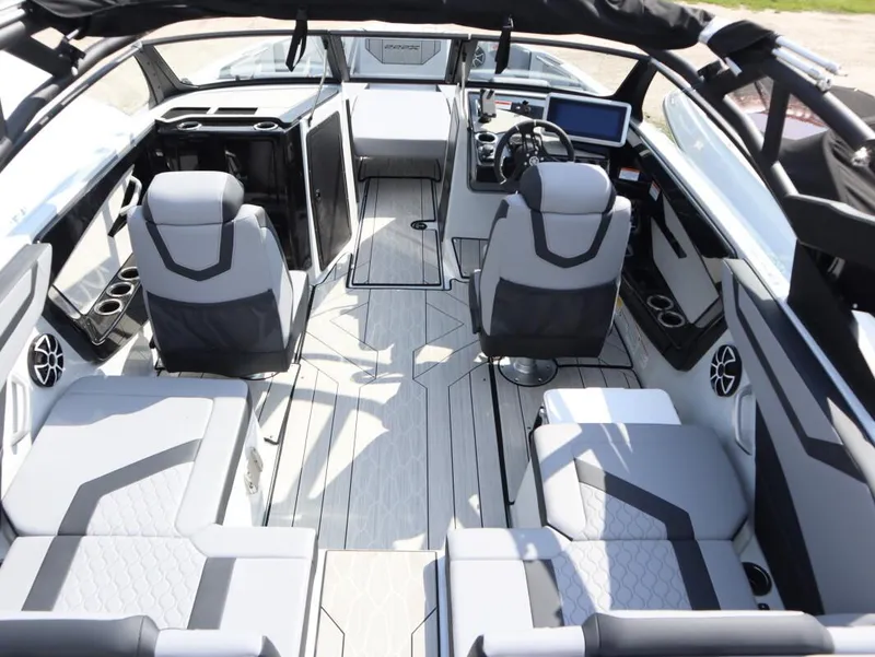 Slide: The Image of 2024 Yamaha Boats 222XE interior with modern seating and advanced dashboard. - 12