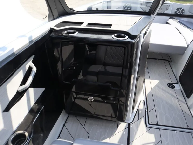 Slide: The Image of Interior of 2024 Yamaha Boats 222XE, featuring sleek seating and modern design elements. - 14