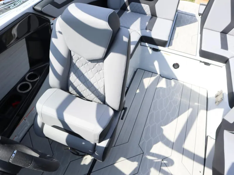 Slide: The Image of 2024 Yamaha Boats 222XE interior seating and steering wheel. - 8