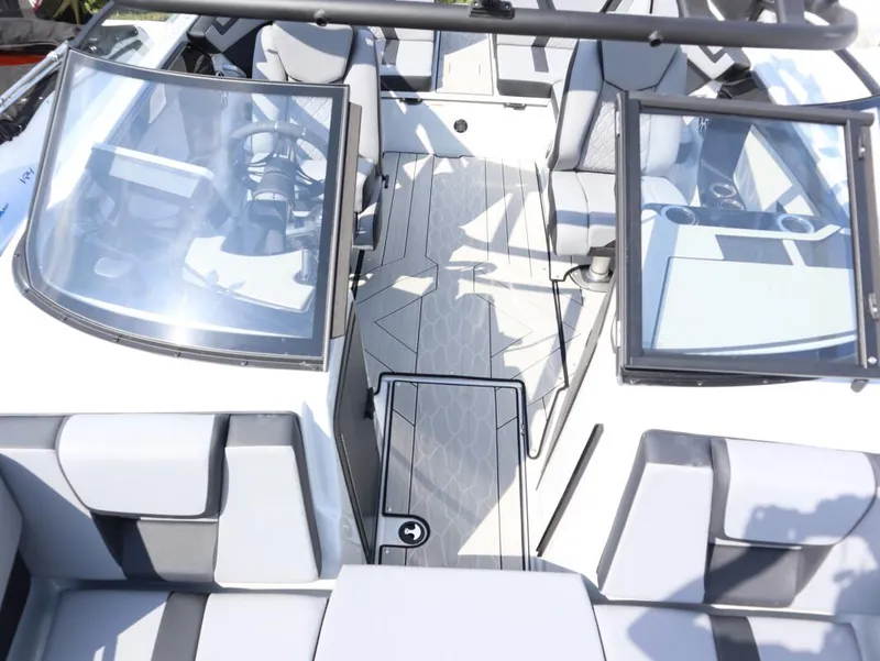Slide: The Image of 2024 Yamaha Boats 222XE interior cockpit with dual windshields and seating. - 9