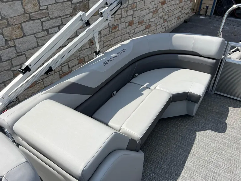 Slide: The Image of 2024 Bennington 22S pontoon boat with gray seating and modern design. - 10
