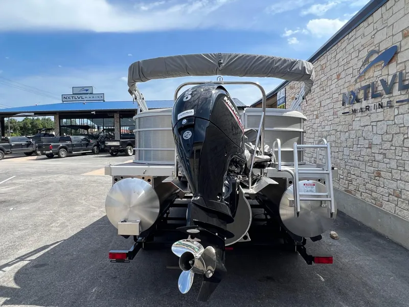 Slide: The Image of 2024 Bennington 22S pontoon boat with Mercury outboard at NXT LVL Marine dealership. - 4