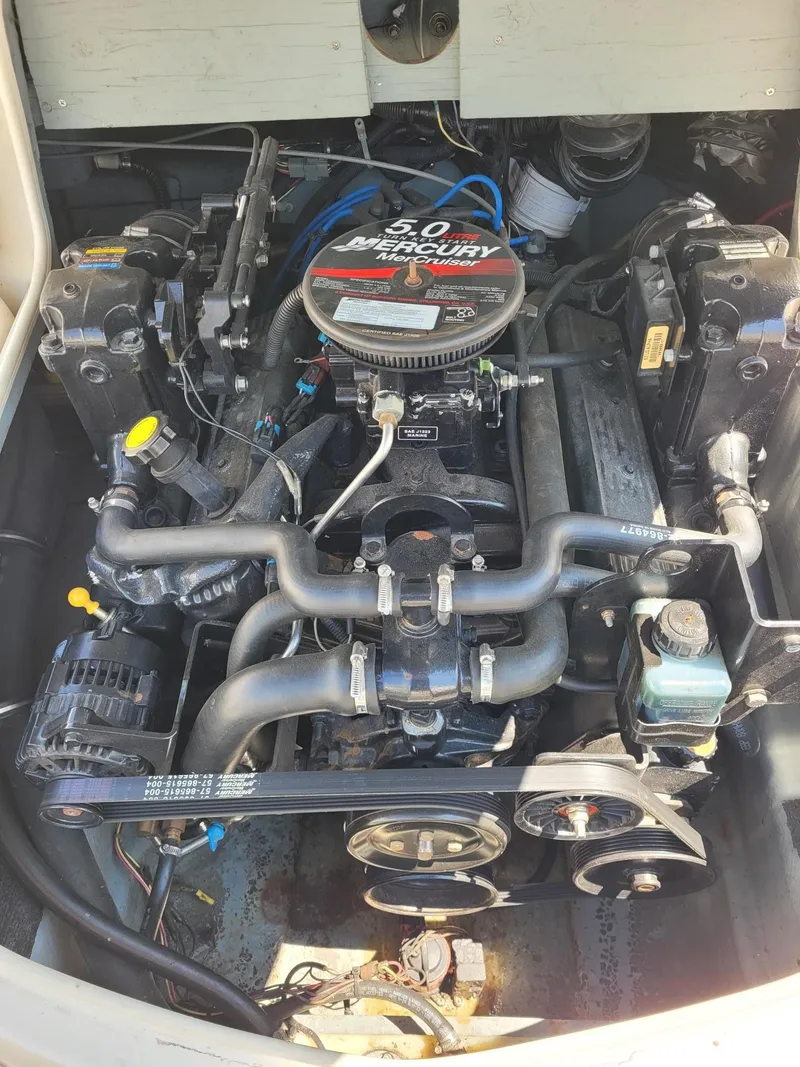 Slide: The Image of 2008 Bayliner 205 boat engine compartment with 5.0L Mercury MerCruiser engine. - 21