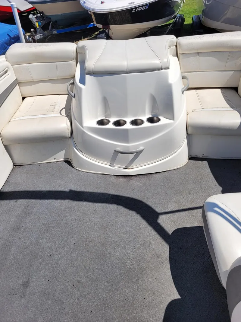 Slide: The Image of Interior seating of a 2008 Bayliner 205 boat with cup holders. - 6