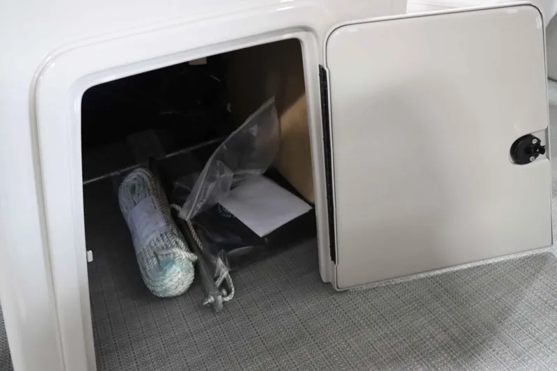 Slide: The Image of Starcraft EXS 3 2025 storage compartment with rope and accessories. - 17