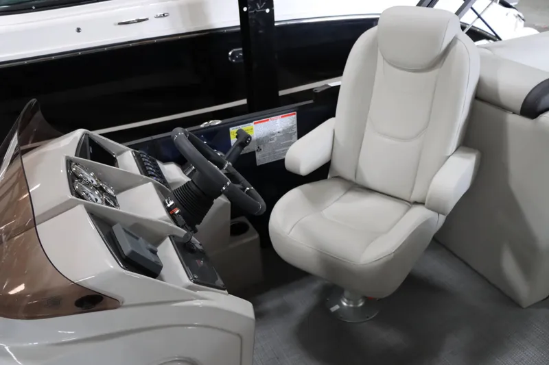 Slide: The Image of 2025 Starcraft EXS 3 boat interior with steering console and captain's chair. - 20