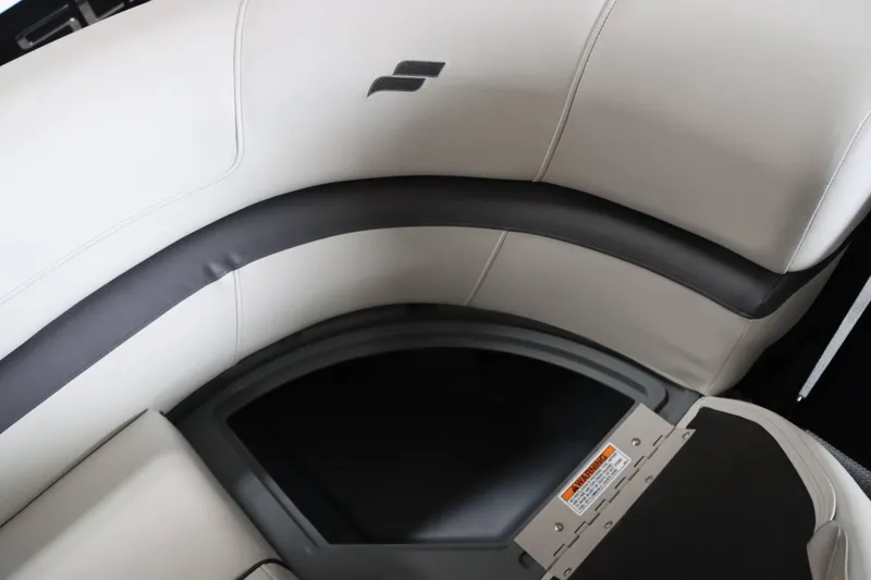 Slide: The Image of 2025 Starcraft EXS 3 boat interior seating with sleek design and storage compartment. - 25