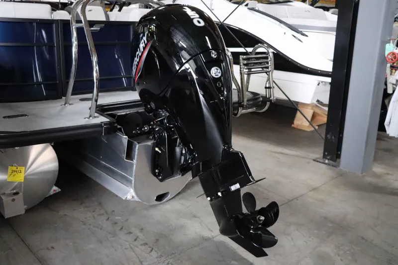 Slide: The Image of Starcraft EXS 3 2025 boat with Mercury outboard motor in showroom. - 6